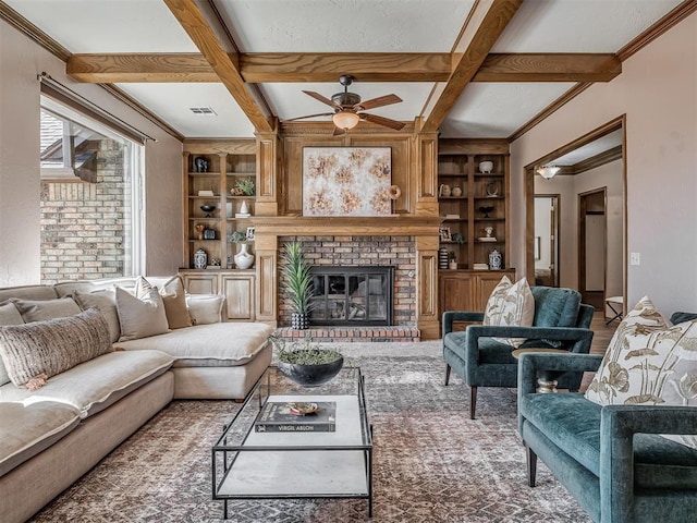 living area with coffered ceiling, a fireplace, beam ceiling, and built in features