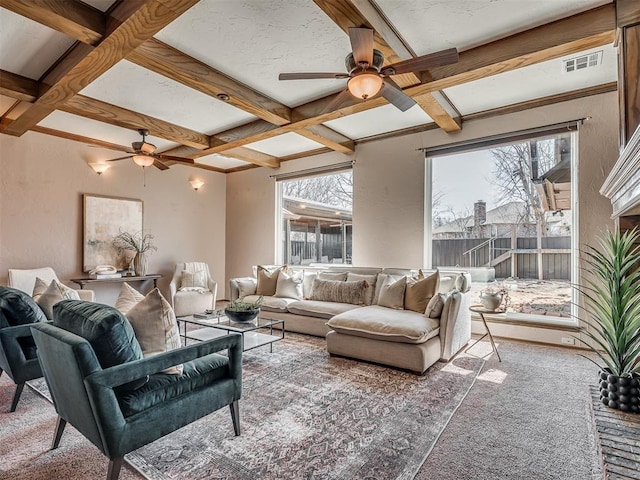 living area featuring beamed ceiling, coffered ceiling, carpet flooring, and visible vents