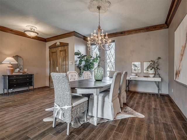 dining room with baseboards, wood tiled floor, ornamental molding, and a notable chandelier