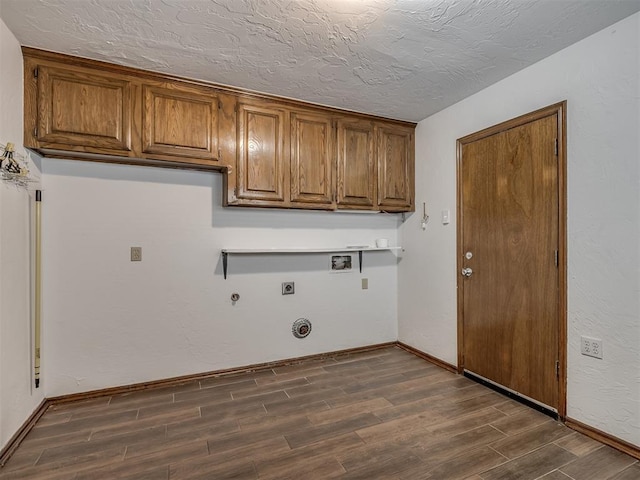 laundry room featuring hookup for a washing machine, hookup for a gas dryer, cabinet space, dark wood-type flooring, and electric dryer hookup