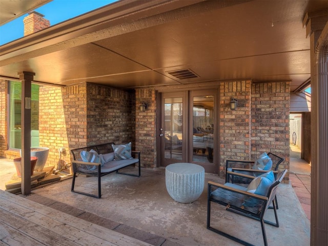 view of patio / terrace featuring outdoor lounge area and visible vents