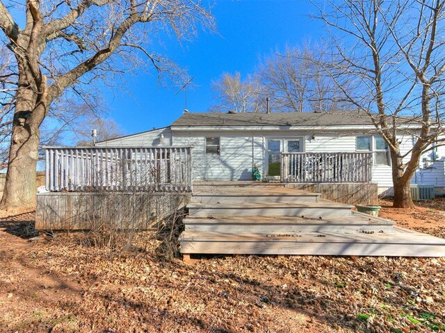 420 W Lincoln St, Purcell, OK 73080 - rear view of property featuring a deck and central AC