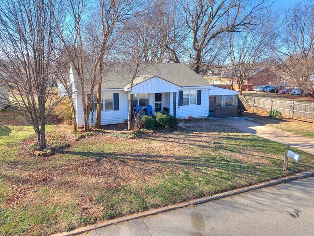 420 W Lincoln St, Purcell, OK 73080 - view of front of property with a shingled roof, fence, a front lawn, and concrete driveway