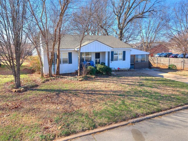 420 W Lincoln St, Purcell, OK 73080 - view of front of home with a front lawn, roof with shingles, and fence