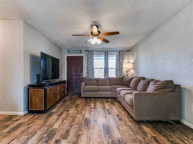 420 W Lincoln St, Purcell, OK 73080 - living room with ceiling fan, a textured wall, a textured ceiling, and wood finished floors