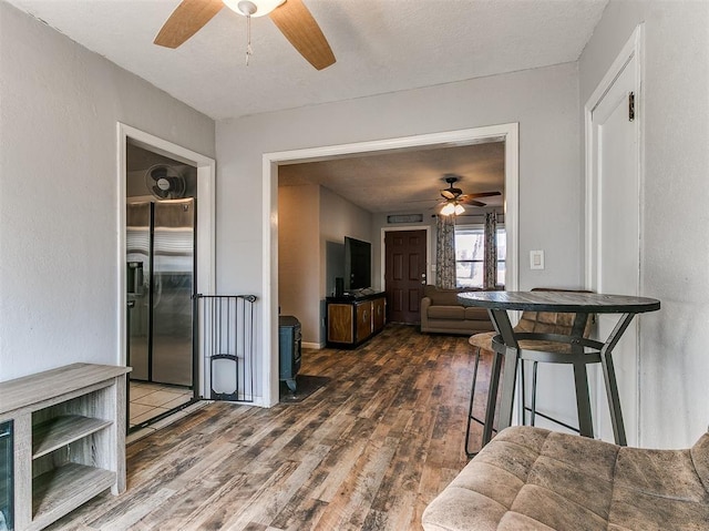420 W Lincoln St, Purcell, OK 73080 - living area featuring ceiling fan, a textured ceiling, and wood finished floors