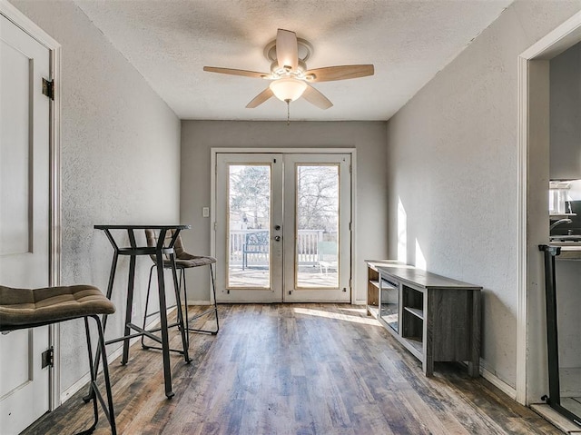 420 W Lincoln St, Purcell, OK 73080 - doorway to outside with a textured wall, ceiling fan, wood finished floors, a textured ceiling, and french doors