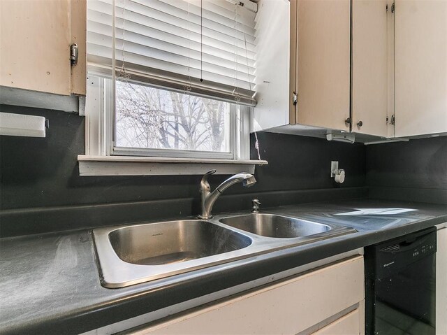 420 W Lincoln St, Purcell, OK 73080 - kitchen with a sink, dark countertops, and dishwasher