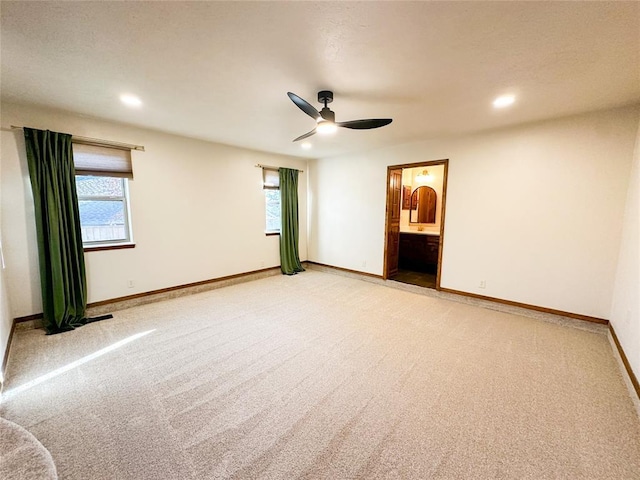 unfurnished room with light carpet, recessed lighting, a ceiling fan, and baseboards