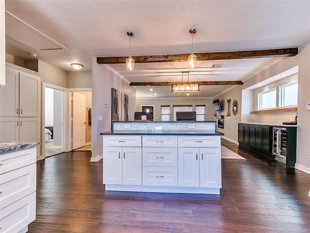 kitchen with baseboards, pendant lighting, dark wood-style floors, and white cabinetry