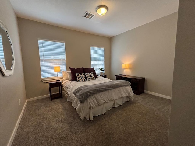 bedroom featuring visible vents, carpet flooring, and baseboards