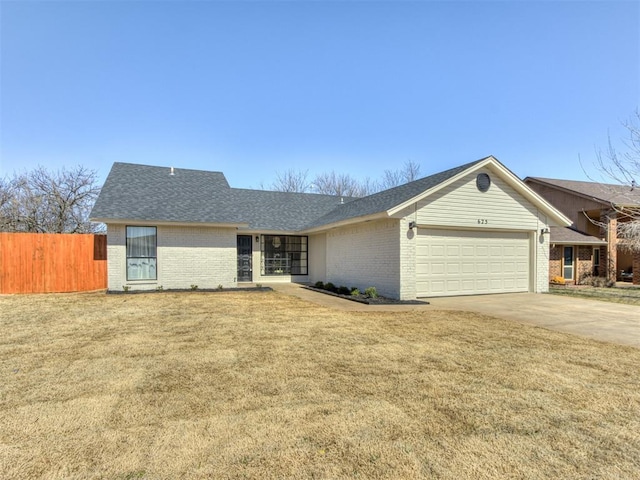 ranch-style house featuring driveway, an attached garage, fence, a front lawn, and brick siding