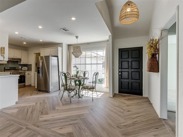 entryway with visible vents and recessed lighting