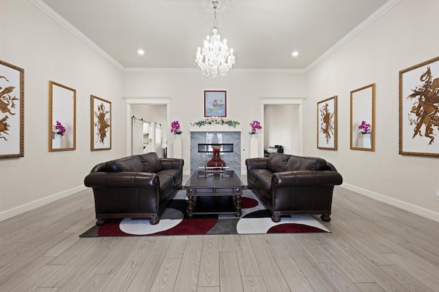 living room with ornamental molding, wood finished floors, and baseboards