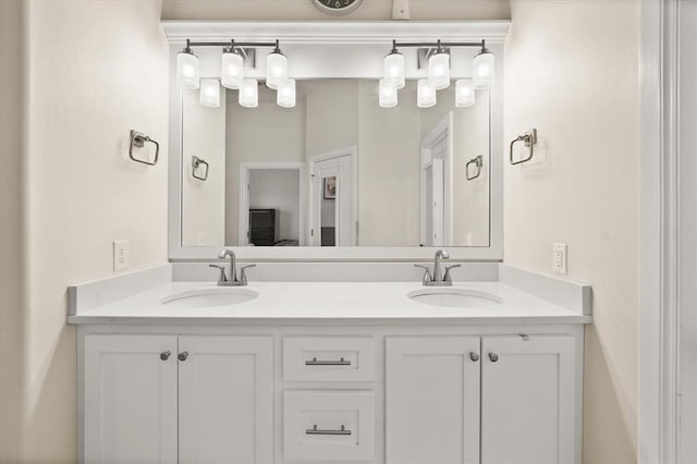 bathroom featuring double vanity and a sink