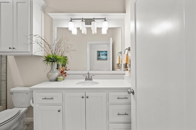 bathroom featuring toilet and vanity