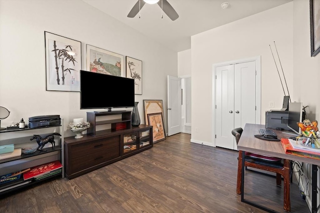 home office with dark wood-style floors, ceiling fan, and baseboards