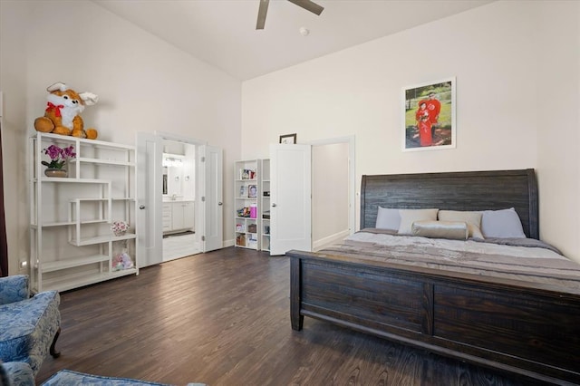 bedroom with high vaulted ceiling, wood finished floors, a ceiling fan, and connected bathroom