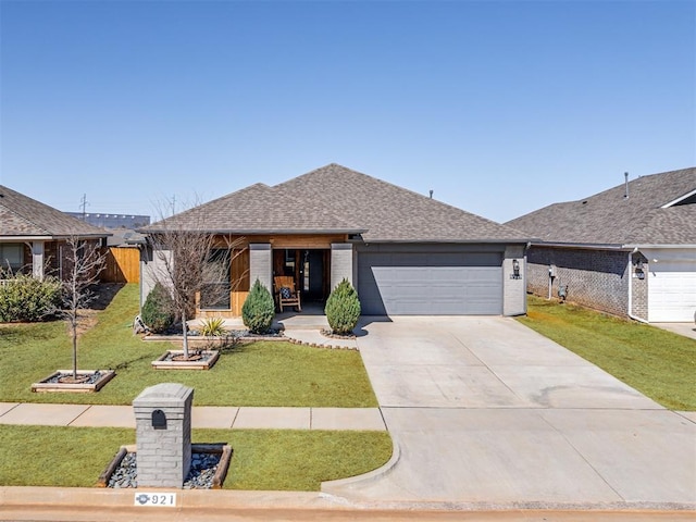 view of front facade with a garage, a shingled roof, fence, driveway, and a front yard