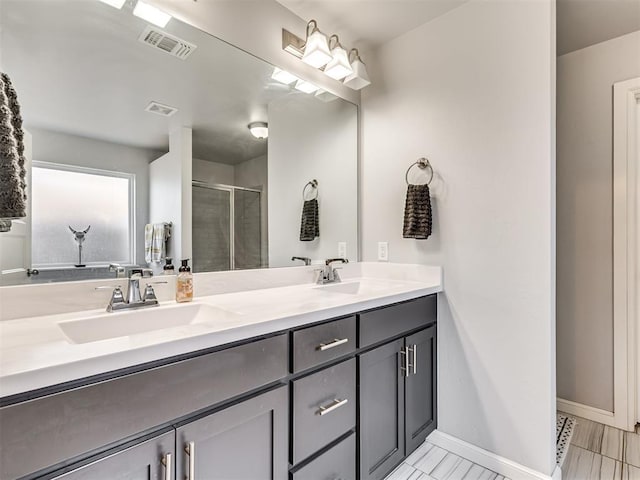 full bath with a stall shower, visible vents, and a sink