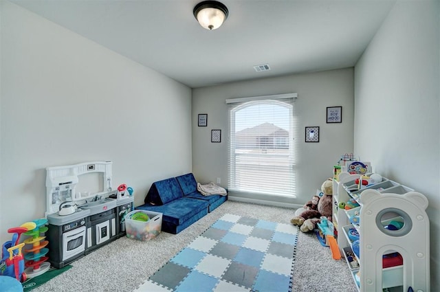 game room with carpet and visible vents