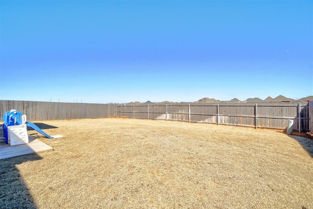 view of yard with a fenced backyard