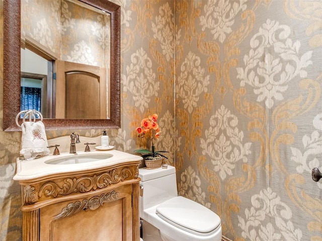 bathroom with vanity and toilet