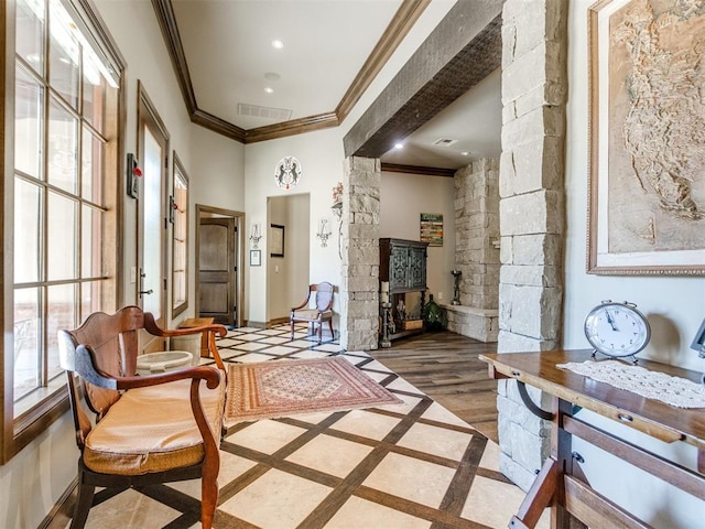 sitting room with ornamental molding, recessed lighting, visible vents, and baseboards