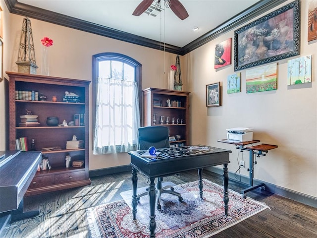 home office with ornamental molding, a ceiling fan, baseboards, and wood finished floors