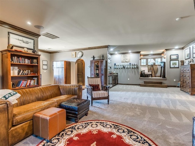 carpeted living area with visible vents, arched walkways, and crown molding