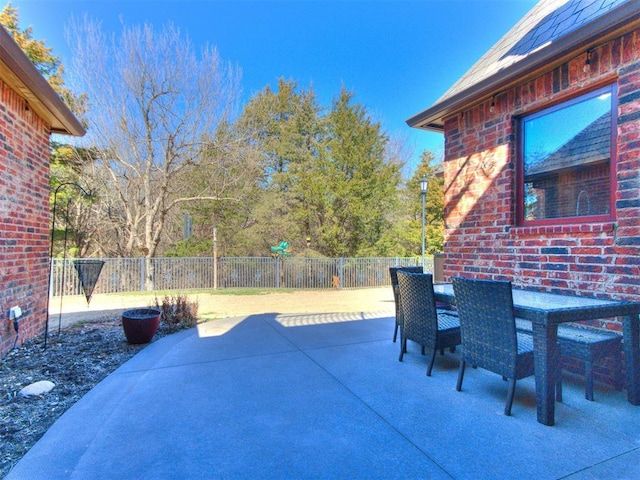 view of patio / terrace with outdoor dining space and fence