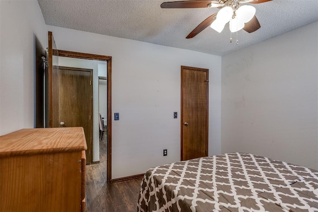 bedroom featuring a ceiling fan, a textured ceiling, and wood finished floors