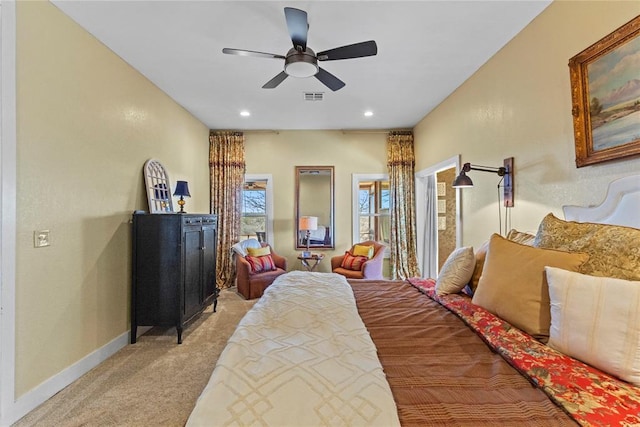 bedroom featuring visible vents, baseboards, recessed lighting, ceiling fan, and light colored carpet