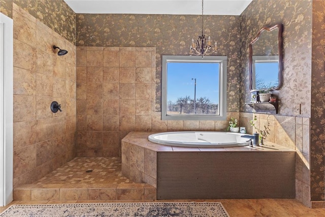 full bathroom featuring a wealth of natural light, tiled shower, a garden tub, and wallpapered walls