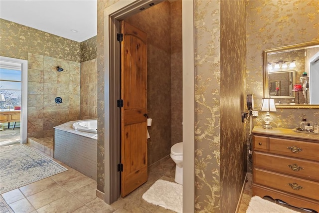 bathroom featuring vanity, wallpapered walls, toilet, tile patterned floors, and a bath