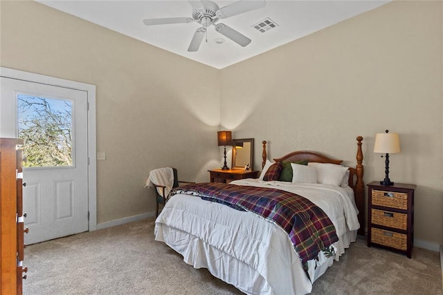 carpeted bedroom featuring visible vents, baseboards, and ceiling fan