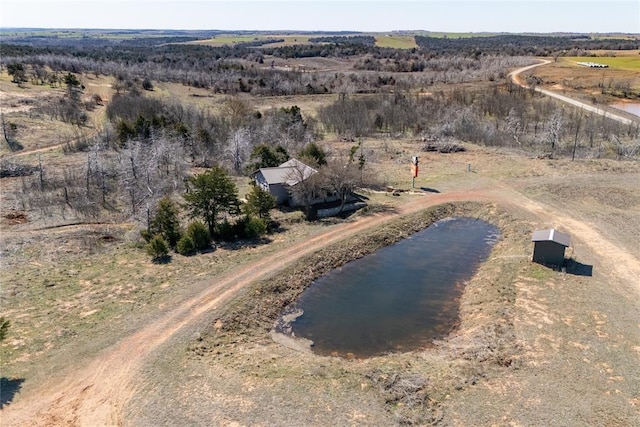 birds eye view of property with a rural view