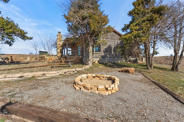 exterior space with a fire pit