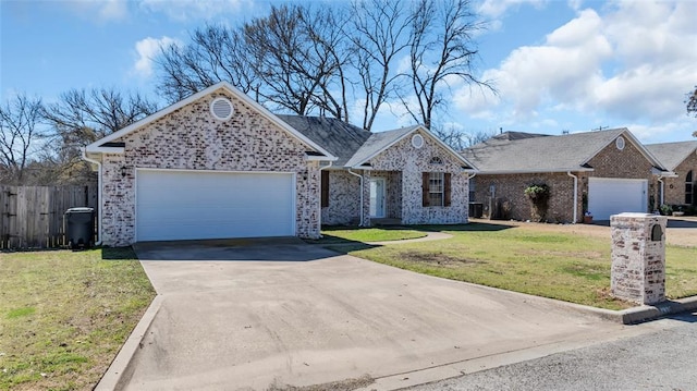 view of front of house featuring an attached garage, brick siding, fence, driveway, and a front yard