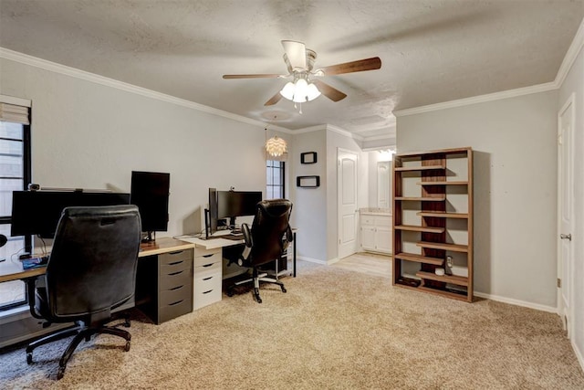 home office with ceiling fan, baseboards, light colored carpet, and ornamental molding