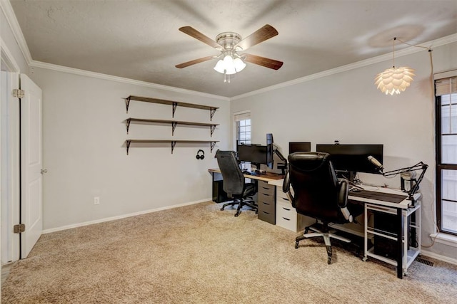 office with baseboards, light colored carpet, ceiling fan, and crown molding