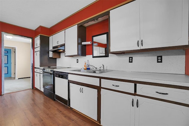 kitchen featuring light countertops, a sink, white dishwasher, range, and under cabinet range hood