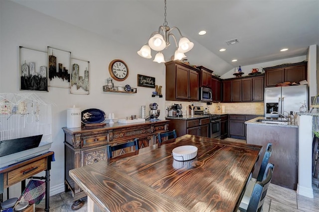 dining room with a chandelier, visible vents, recessed lighting, and lofted ceiling