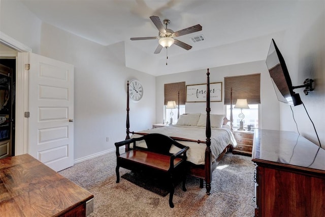 carpeted bedroom featuring a ceiling fan, baseboards, and visible vents