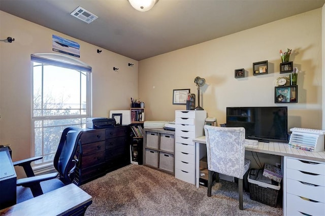 home office with carpet flooring and visible vents