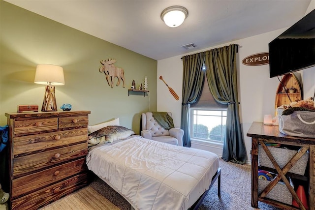 bedroom featuring visible vents and carpet