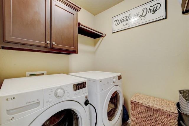 laundry area with cabinet space and washing machine and clothes dryer