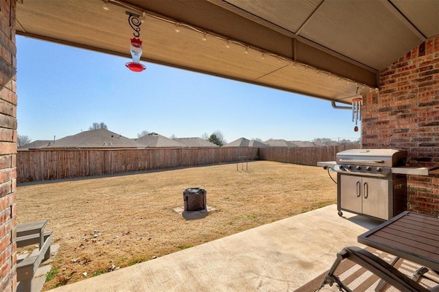 view of patio featuring a grill and a fenced backyard