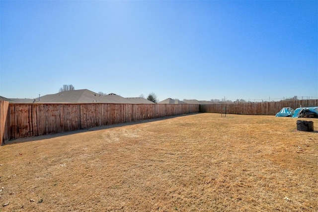 view of yard with a fenced backyard