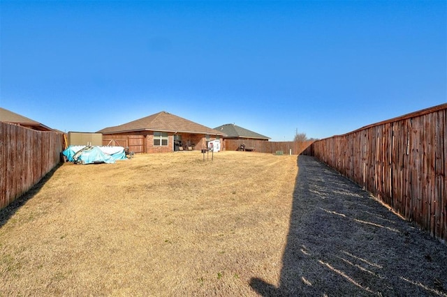 view of yard with a fenced backyard